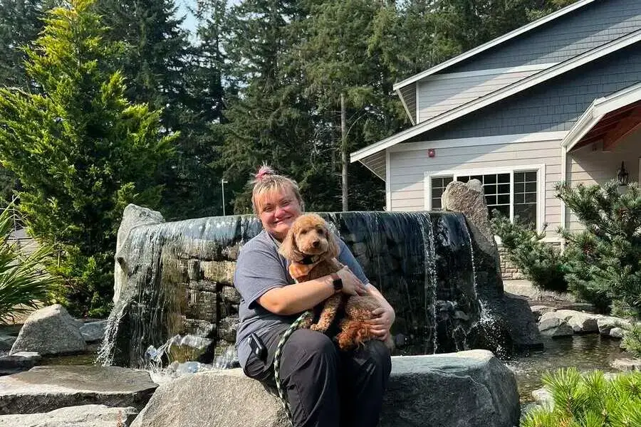 Wooded trails and open grass on Friendly Grove's 28-acre property in Olympia, WA